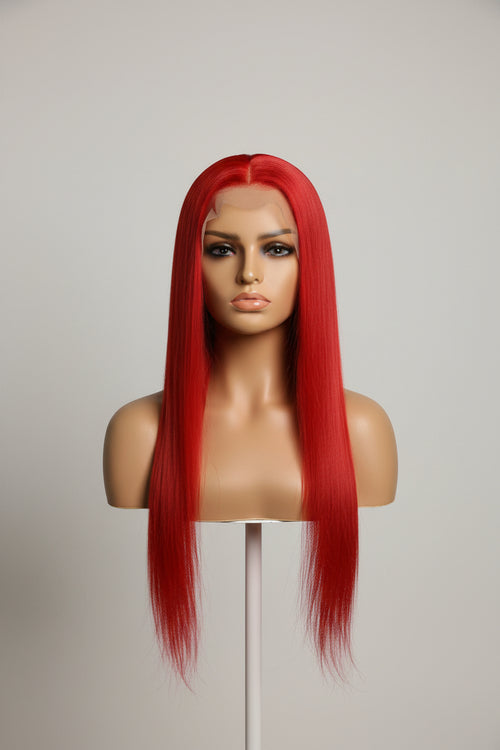 Red wig on a mannequin head in an indoor